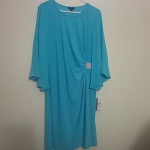 A light blue bell sleeve dress with rhinestones